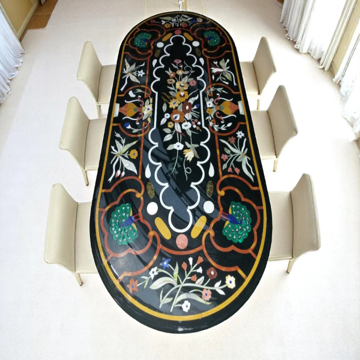 Oval black marble inlay table with artistic handcrafted design