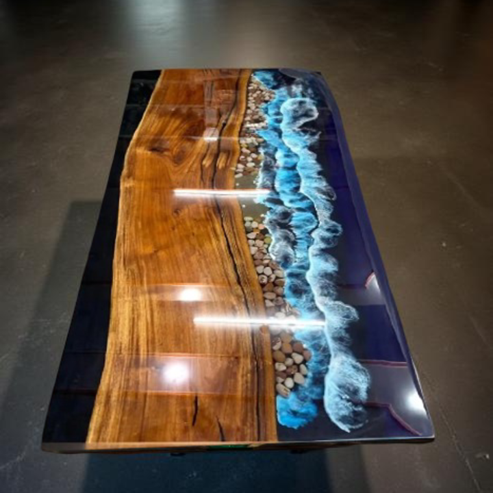 Handmade ocean epoxy resin table with live edge poplar wood slab and glossy blue resin finish for luxury interior décor.