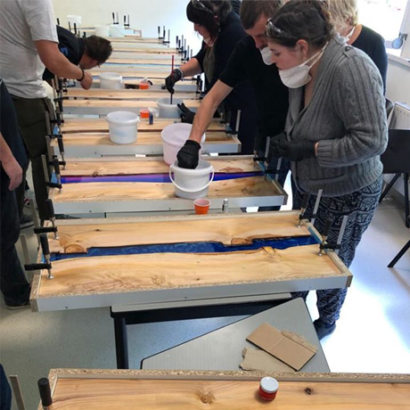 Epoxy resin table mold setup with wood slabs before pouring resin